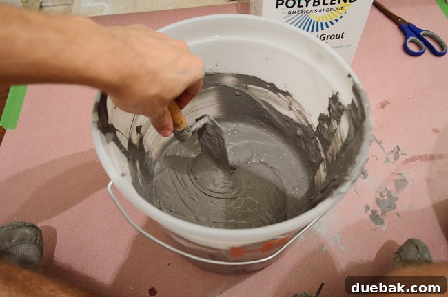 Mixing grout in a bucket