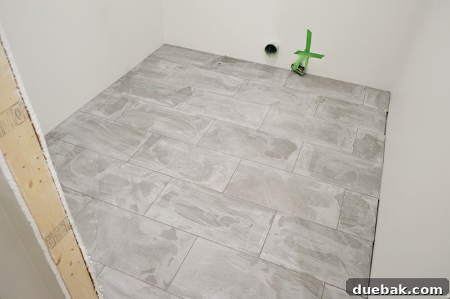 Grout haze visible on newly tiled floor