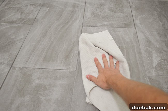 Buffing grout haze with a dry microfiber cloth