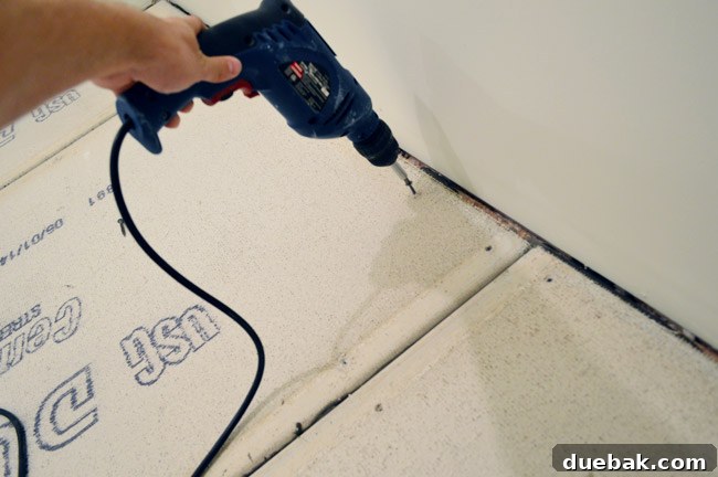 Applying mesh tape to cement board seams