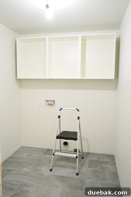 Mastering Ikea Cabinet Installation 24 Three IKEA upper cabinets installed on the laundry room wall