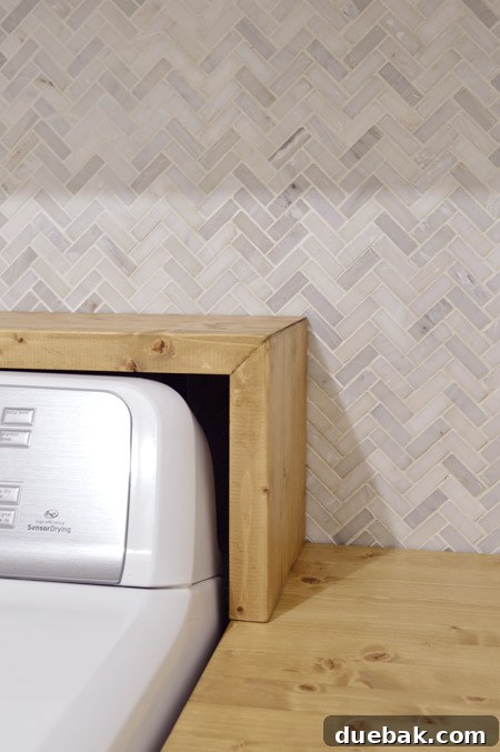 Craft Your Own Waterfall Countertop 2 Newly installed custom laundry room shelf with a waterfall edge and natural wood stain