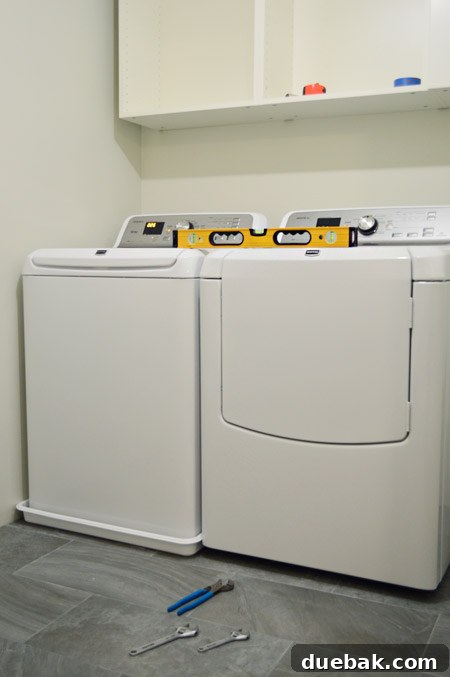 Seamless DIY Waterfall Countertop 11 Washing machine placed inside washer pan