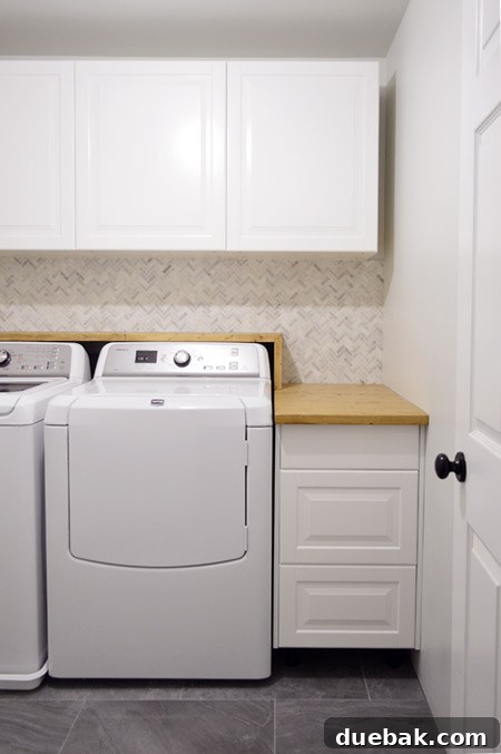 Craft Your Own Waterfall Countertop 3 Wider view of the laundry room showing the custom shelf, appliances, and newly tiled floor