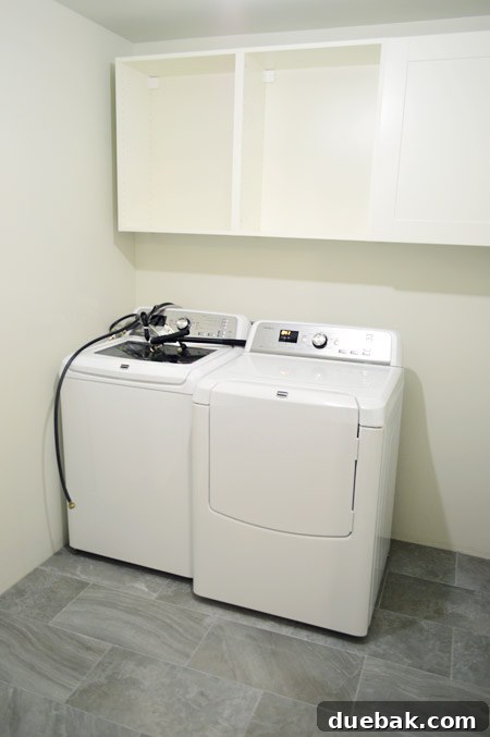 Craft Your Own Waterfall Countertop 6 Laundry room showing initial appliance placement with tape markers for washer pan