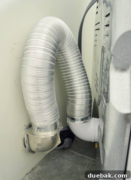 Seamless DIY Waterfall Countertop 7 Dryer vent hose extended from wall