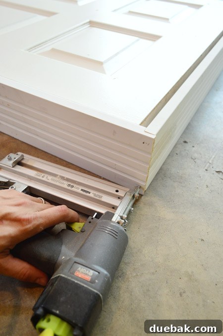 Nailing Together DIY Door Jamb From Top Of Rabbet Joint With Nail Gun