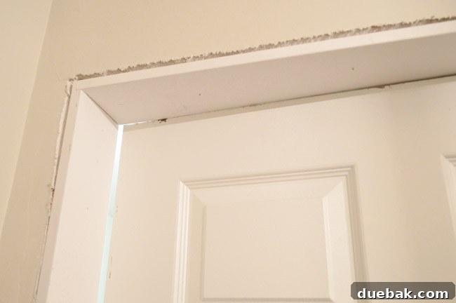 Testing Fit Of Door In Laundry Room Jamb