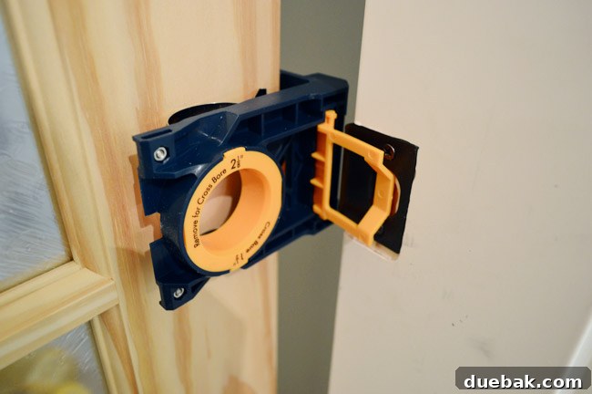 Ryobi Door Lockset Kit Clamped To Unfinished Door To Mark Location Of Knob And Strikeplate