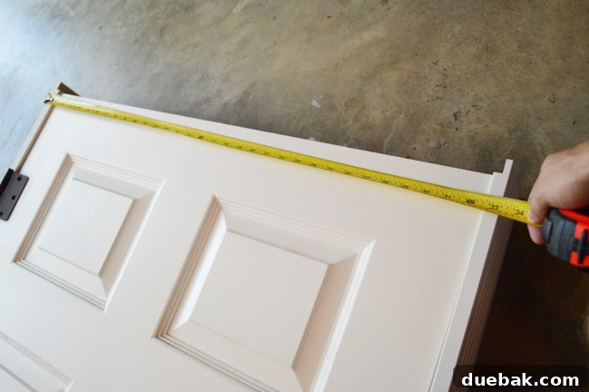 Tape Measuring Door For Jamb Length On Top Of Door