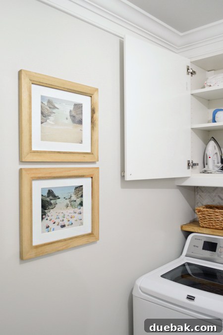 Framed art pieces in the laundry room