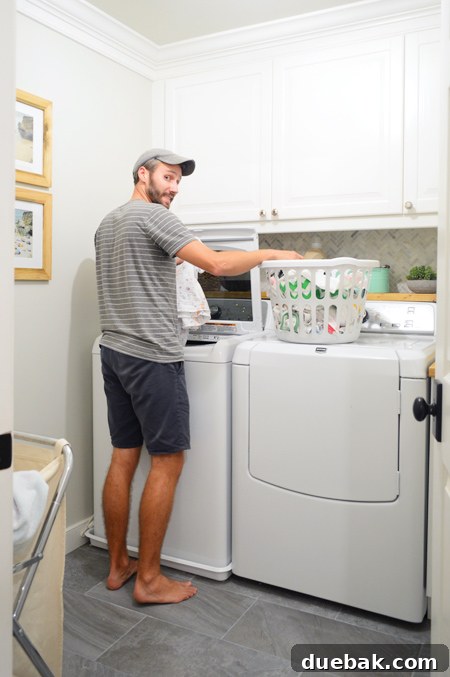 John enjoying the finished laundry room