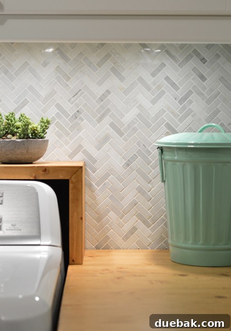 Laundry room interior showing under-cabinet lighting