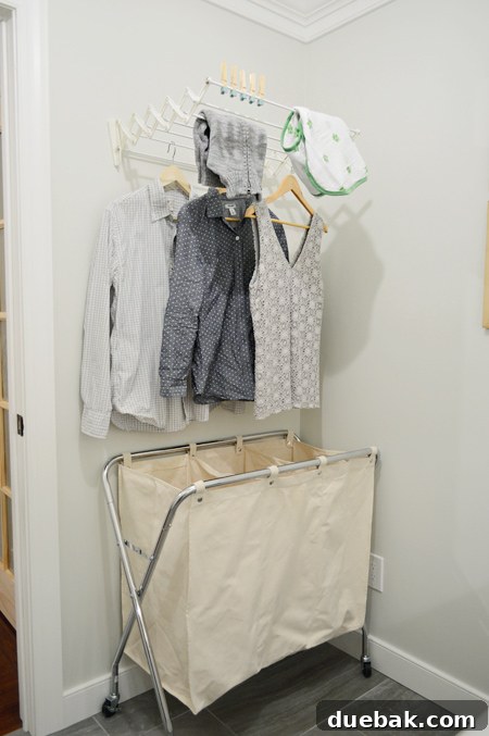 Wall-mounted pull-out drying rack in the laundry room
