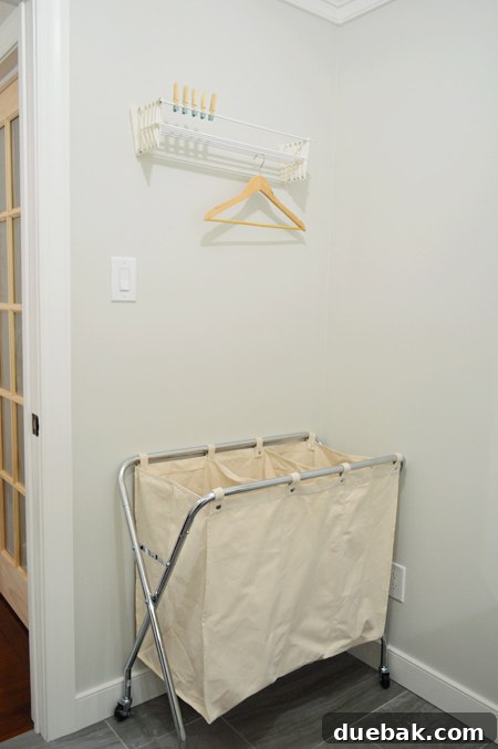 Drying rack in closed position, blending with the wall