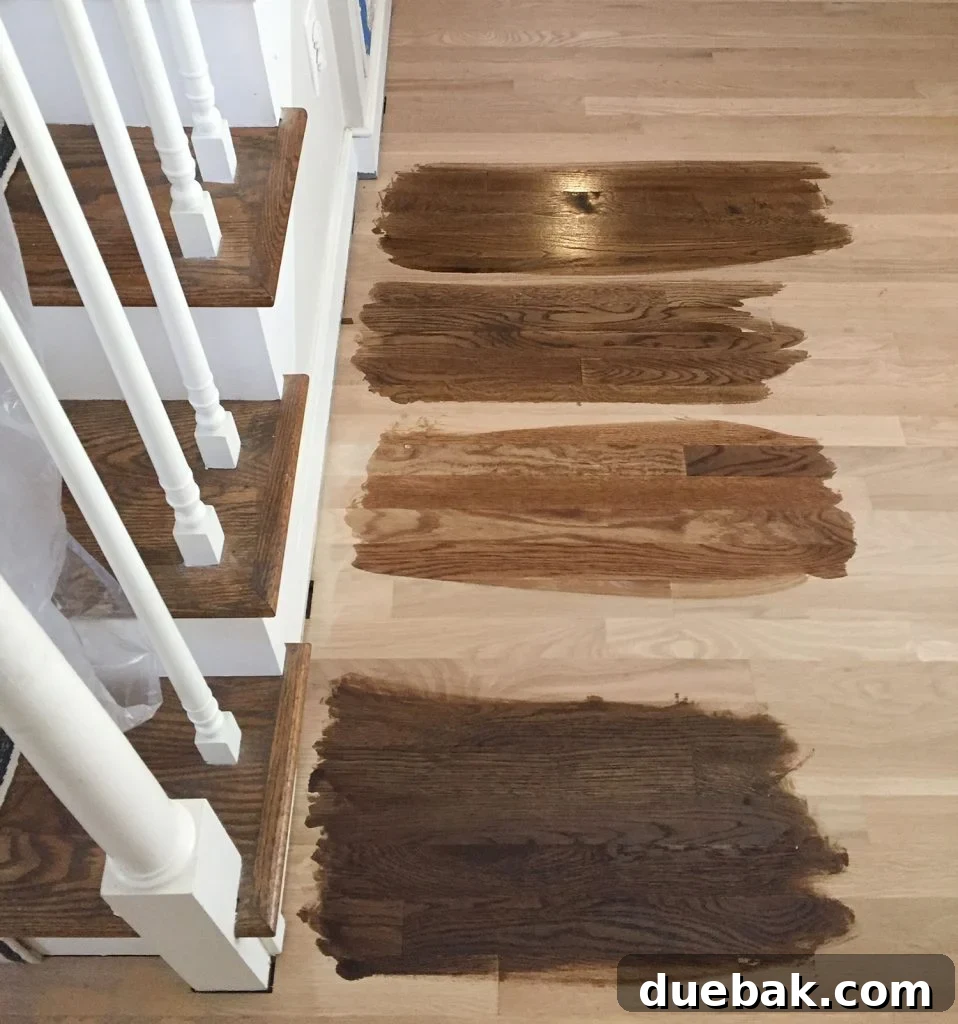 Revitalizing Hardwood Floors The Beginner's Handbook 12 Professional testing various stain colors on sanded hardwood floors during refinishing to visualize options