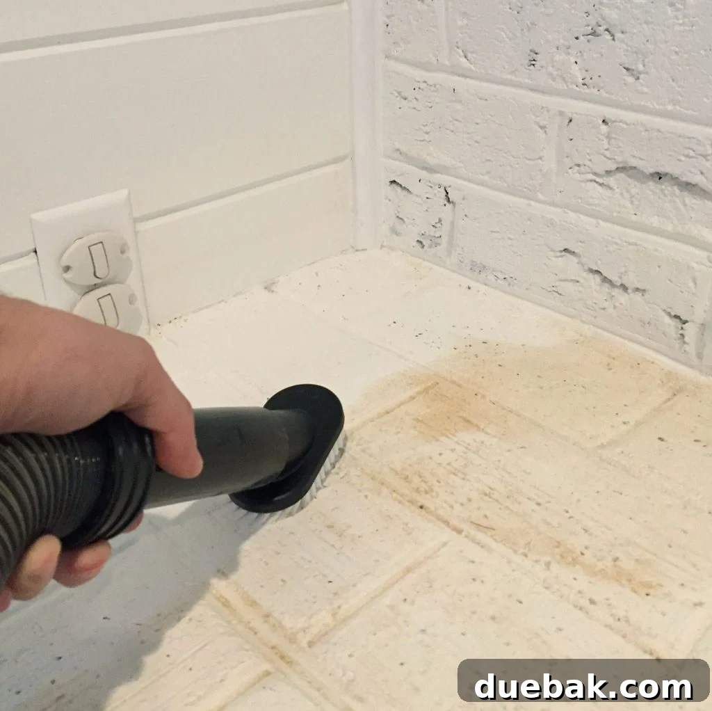 Revitalizing Hardwood Floors The Beginner's Handbook 14 Professional vacuuming up fine sanding dust from hardwood floor refinishing project for final clean