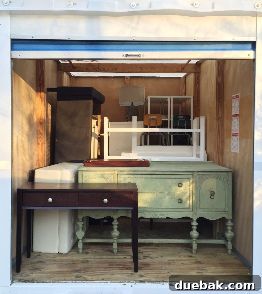 Revitalizing Hardwood Floors The Beginner's Handbook 16 Furniture meticulously stacked in a storage unit during a hardwood floor refinishing project