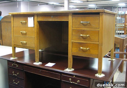 A sturdy, chunky teacher's desk with potential for an office space, found at Diversity Thrift