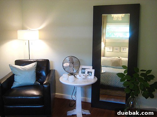 Old Bedroom with Pedestal Table Old bedroom setup featuring a white DIY pedestal table next to a leather armchair, highlighting previous decor