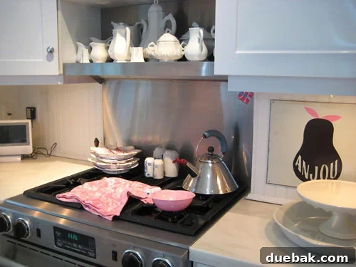 Close-up of pink dish towel and white ceramic collection in Katie Ukrop's kitchen