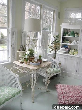 Sunroom with plants, white built-ins, and a dog resting on a pink pillow
