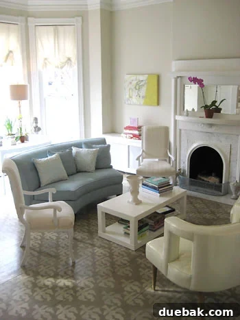 Elegant living room parlor featured in Domino Magazine with stenciled painted wood floors