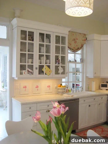 Katie Ukrop's elegant white kitchen with beadboard backsplash and functional design