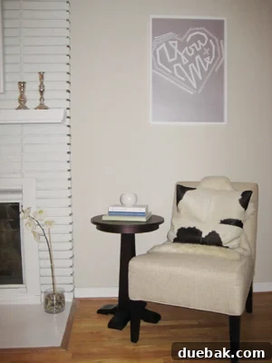 Hold Onto Your Seats 2 Chic grey slipper chair with a sheepskin throw draped over it, enhancing comfort and style.