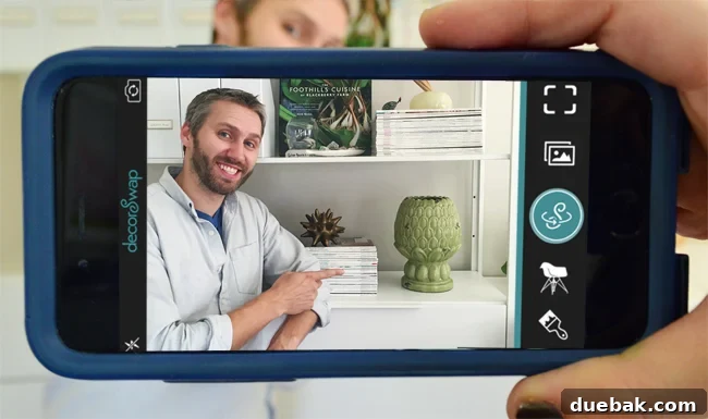 Screenshot of the decorSwap app showing a phone camera pointed at a living room, ready to take a picture for virtual decor
