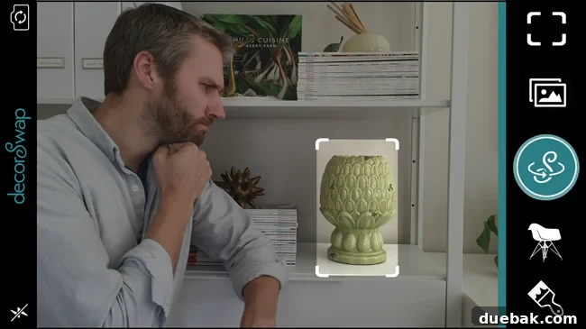 Screenshot of decorSwap app showing a user selecting an object in a room with their finger, highlighting smart edge detection