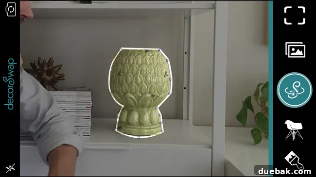Screenshot of decorSwap app showing a user refining the selection of an object, with the outline changing color to indicate locking