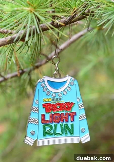 Cherished Miles, Festive Shine: Crafting Medal Ornaments 8 Race medal ornament hung with a decorative metal hook instead of a ribbon, showcasing an alternative display method