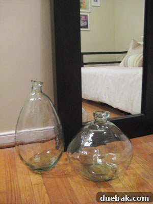 Two elegant, oversized glass vases from ZGallerie, designed to be sophisticated home decor pieces
