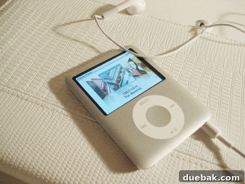 A brand new silver iPod Nano displayed prominently, highlighting its sleek design and advanced features