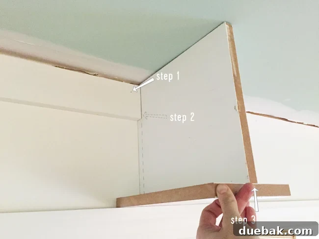 Tailored Book Nooks DIY Built Ins 18 A 1x4 header piece being attached to the wall above a doorway, crucial for securing the spanning bookshelf