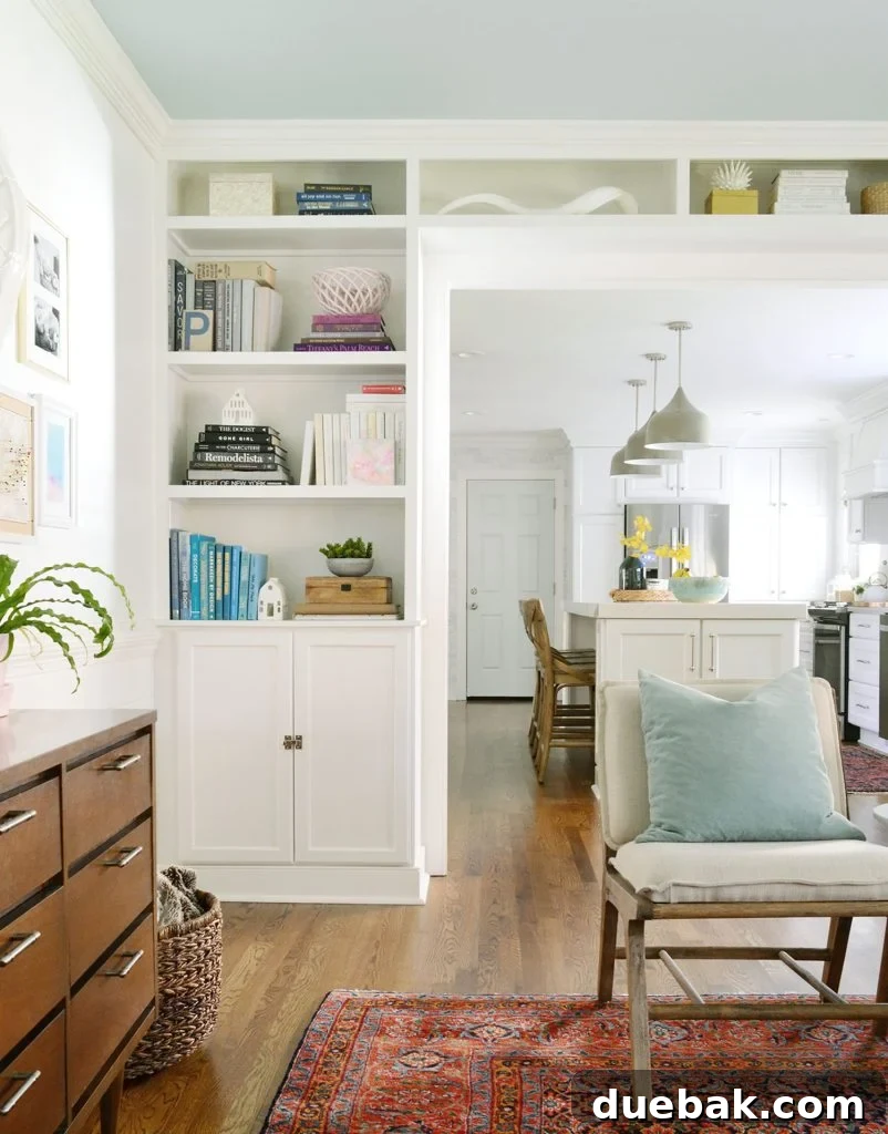 Tailored Book Nooks DIY Built Ins 4 A collection of essential tools and materials, including Simply White paint, arranged for a DIY bookcase project