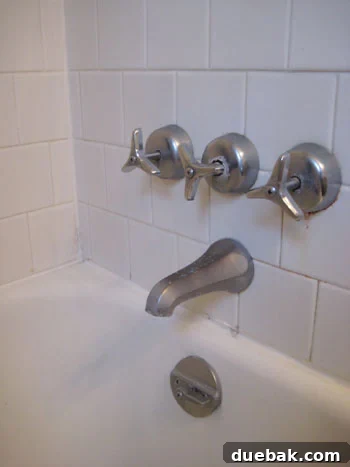 The Secret to Flawless Caulk Lines 8 Old and corroded bath and shower fixtures, showing visible signs of wear, rust, and age