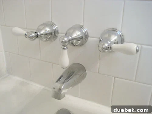 The Secret to Flawless Caulk Lines 9 Newly installed retro-style chrome bath and shower fixtures, providing a fresh and clean update