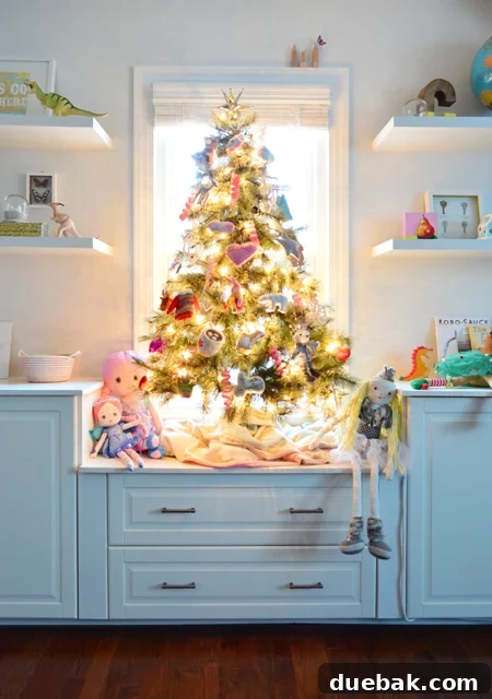 Our festive new Christmas tree bringing holiday cheer to the bonus room at Young House Love