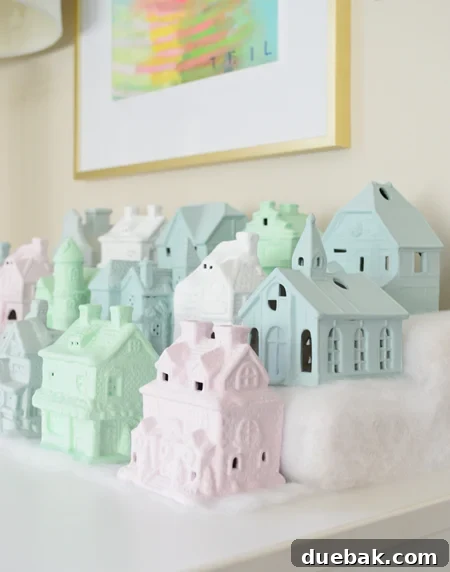 Crafting a Festive Painted Village 16 Completed Pastel Christmas Village Display with Snowy Base
