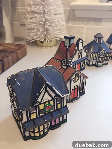 Crafting a Festive Painted Village 5 Close-up of Worn Miniature Ceramic Houses