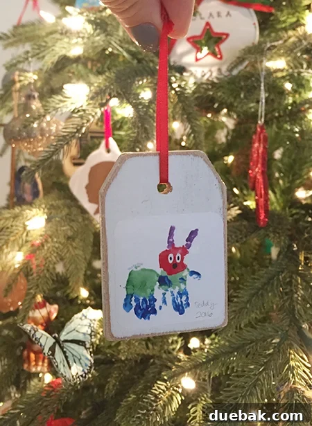 Finished wooden tag ornaments hanging, showcasing the simplicity and charm of the handmade items.