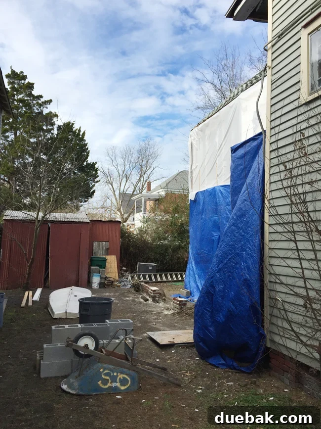 From Studs Up: The Beach House Revival 11 Exterior view showing a large section of the beach house completely removed due to structural damage.