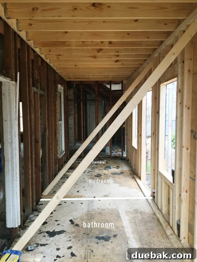 From Studs Up: The Beach House Revival 25 Interior view of the newly framed breakfast nook area, showing its spaciousness.
