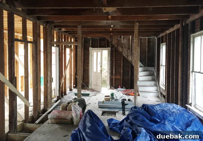 From Studs Up: The Beach House Revival 28 Interior view showing the future dining area looking towards the relocated kitchen and breakfast nook.