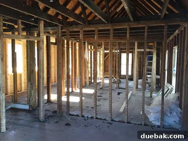From Studs Up: The Beach House Revival 8 Upstairs interior after demolition, showing exposed framing and the general state of the space.