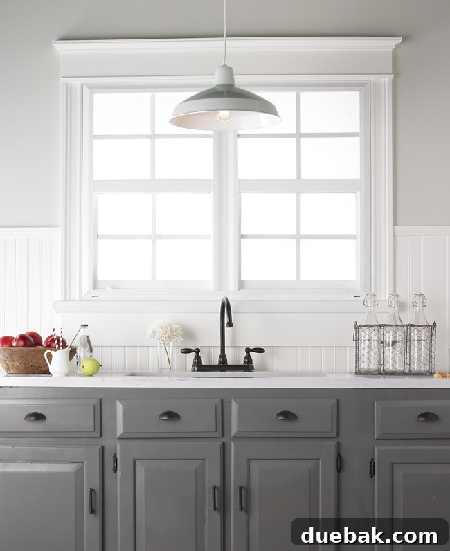 Photographer capturing various lighting fixtures in a staged setting