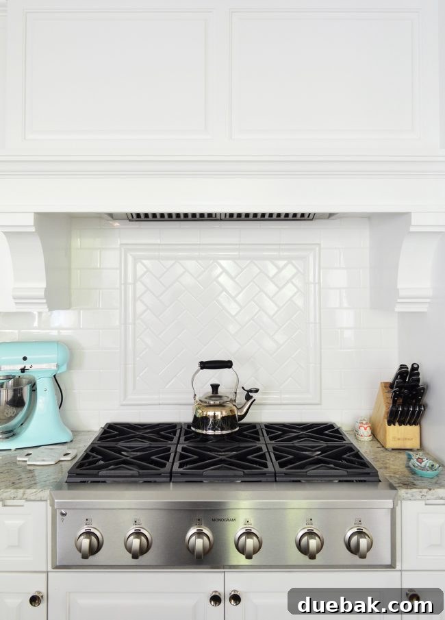 Kitchen Stove with Herringbone Tile and Custom Hood