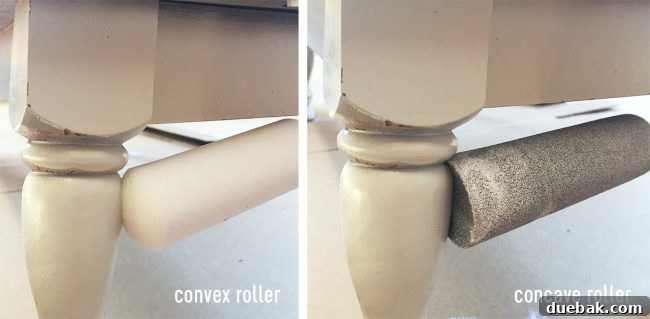 A close-up shot of a concave paint roller being used on a curved furniture leg, demonstrating its superior contour-hugging capability compared to a traditional roller